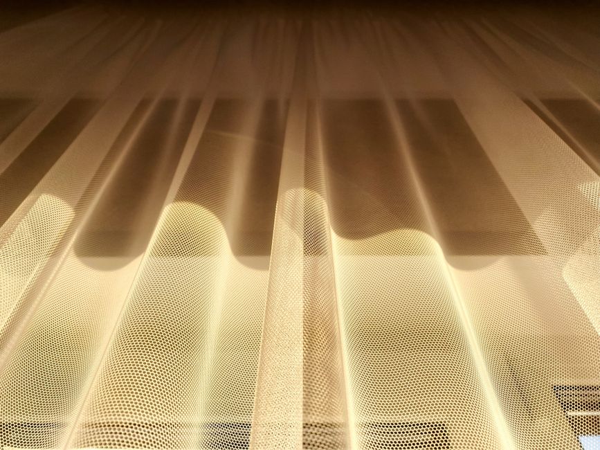 Soft window light during a breathwork circle