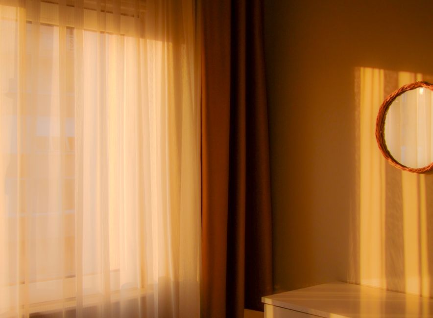 Morning light filling the studio during a flow class